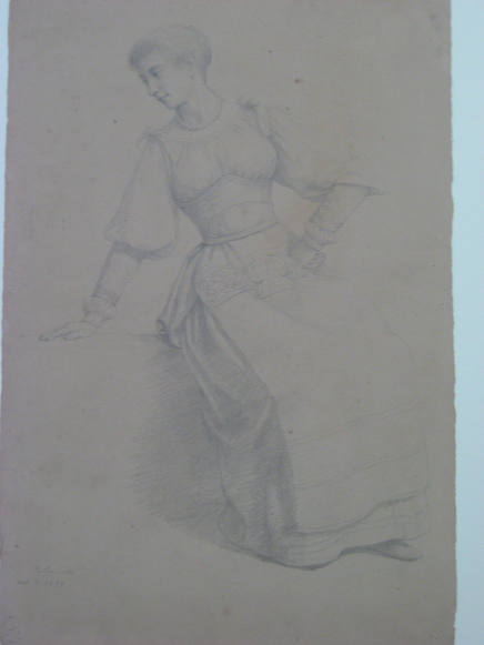 Woman in native dress, seated with hand on hip