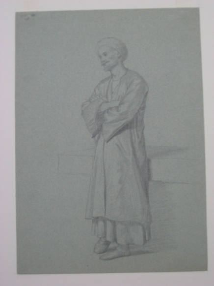 Untitled - A man in a robe and turban, standing with arms folded