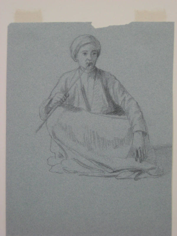 Untitled - Arab seated cross-legged holding a pipe to his mouth