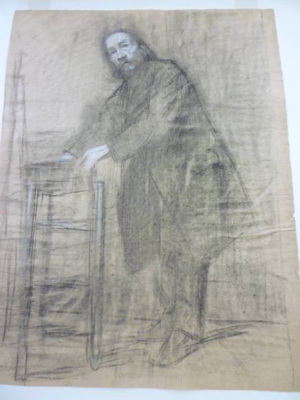 Study of standing male reaching into box on chair