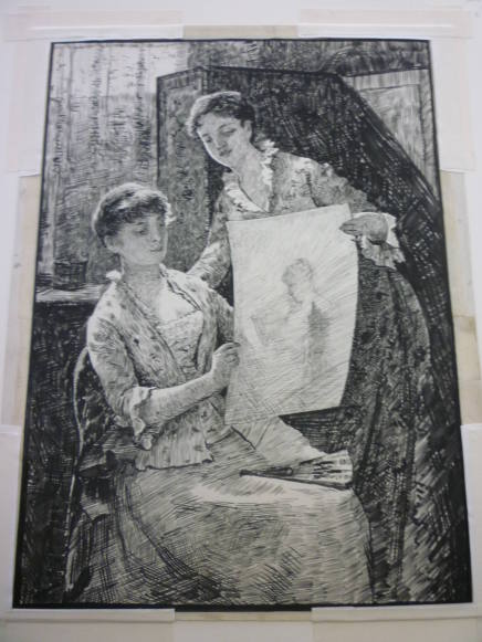 Two women looking at a sketch