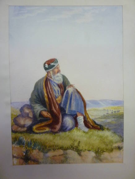 Arab man seated in landscape